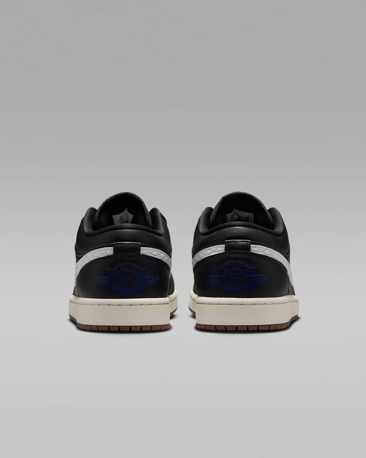 Air Jordan 1 Low Black White Quilted Swoosh Gum Outsole Leather Sneakers